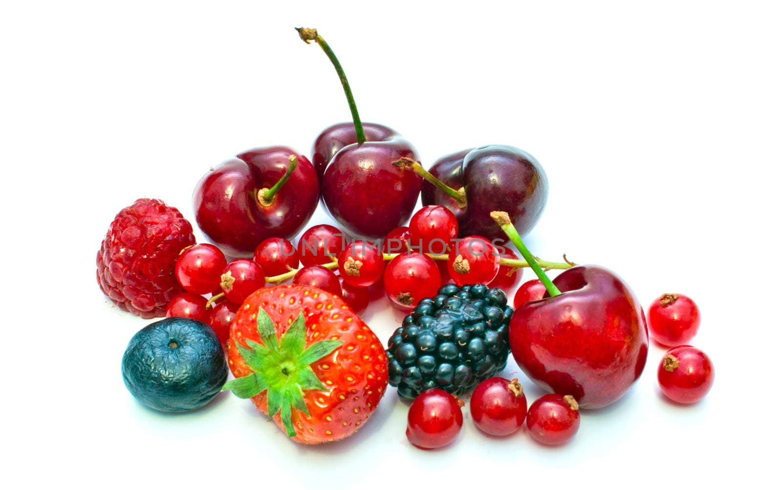 few different berries on a white background