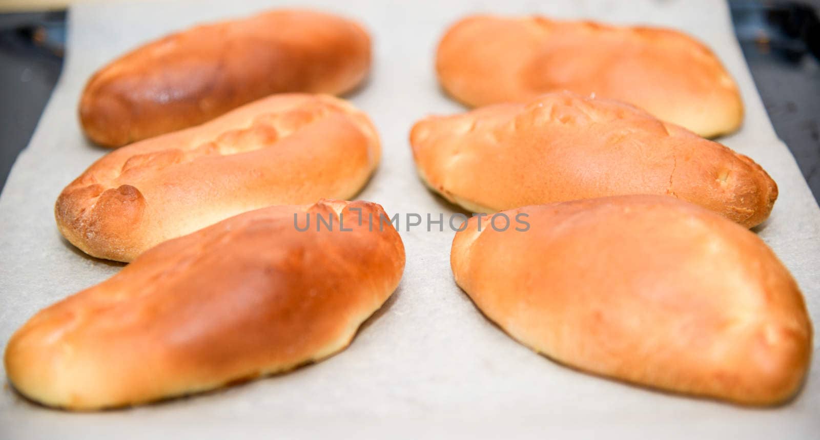 the Golden patties on a parchment paper