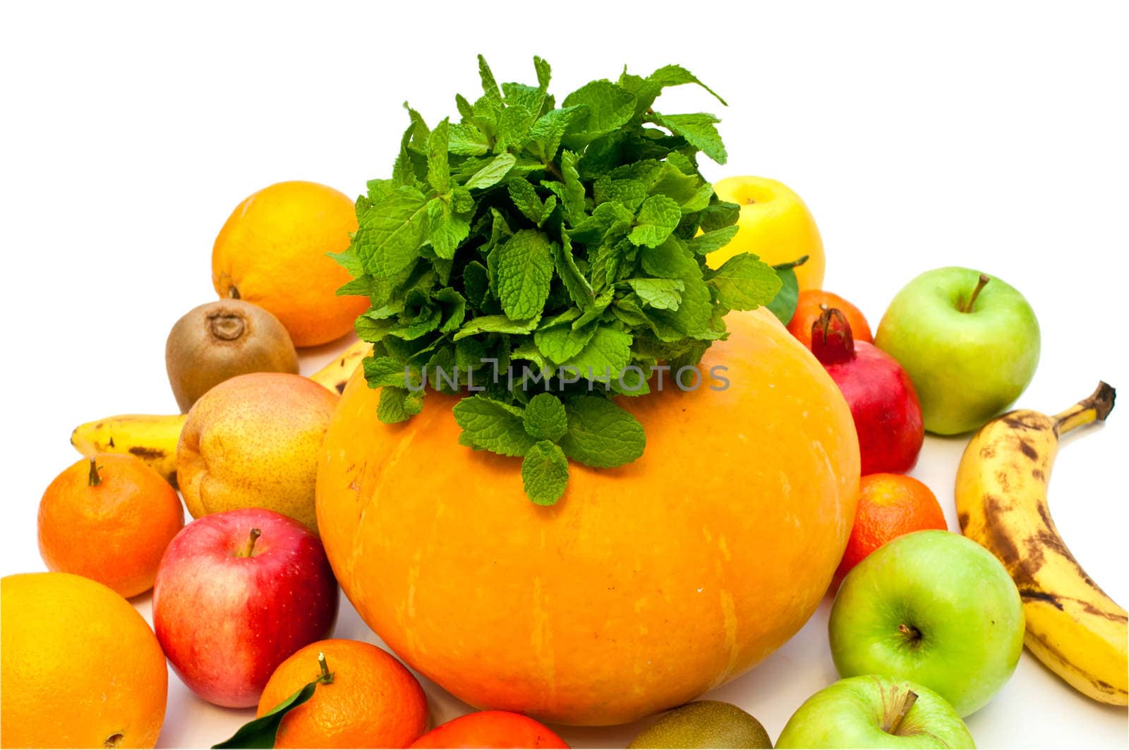 pumpkin and lots of different tropical fruits on a white background