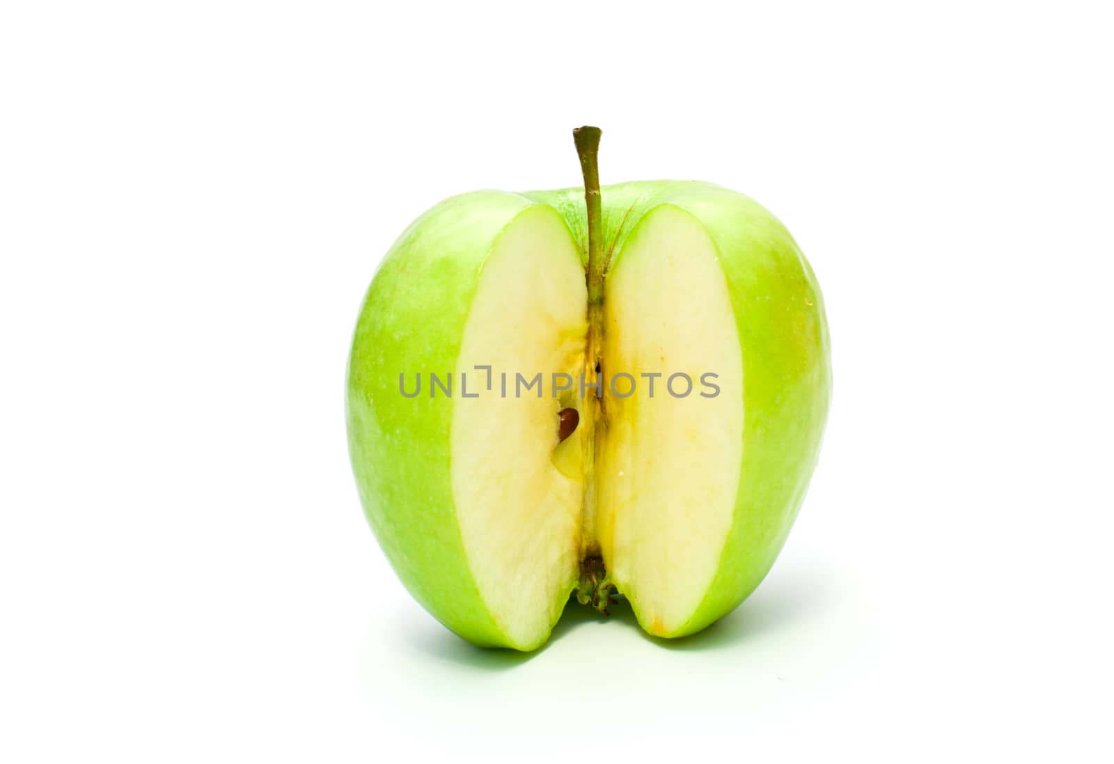 sliced apple on white background by vlaru