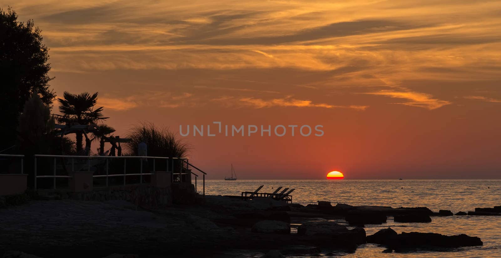 gorgeous sunset on the rocky coast of Adriatic by vlaru