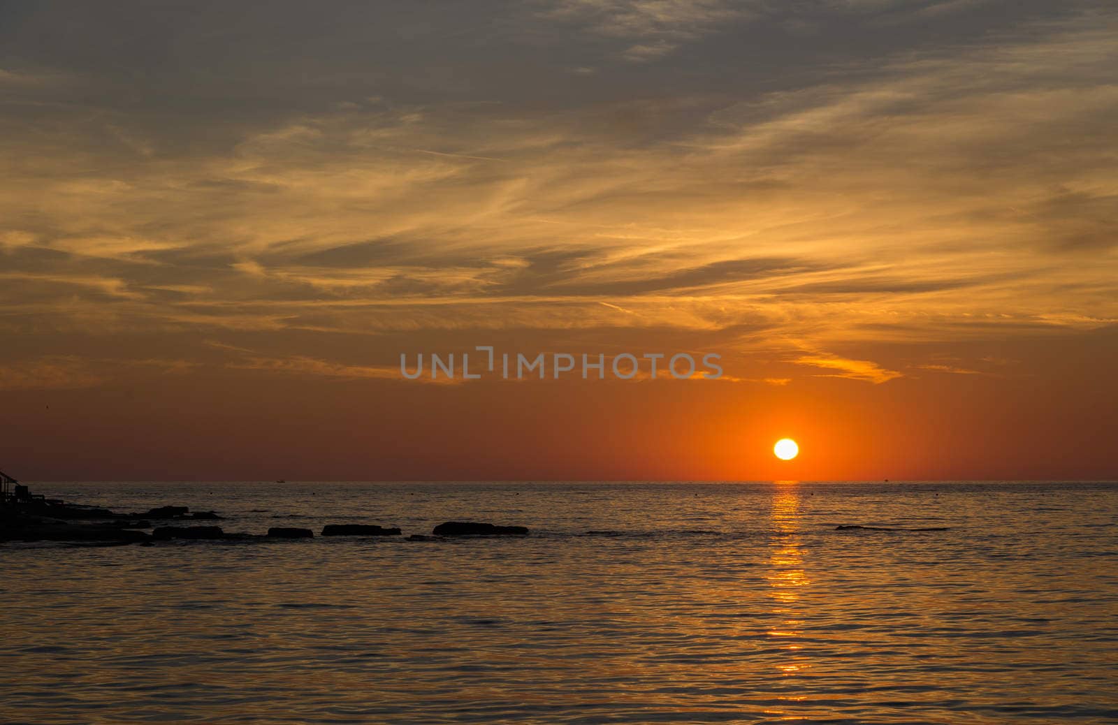 gorgeous sunset on the rocky coast of the Adriatic