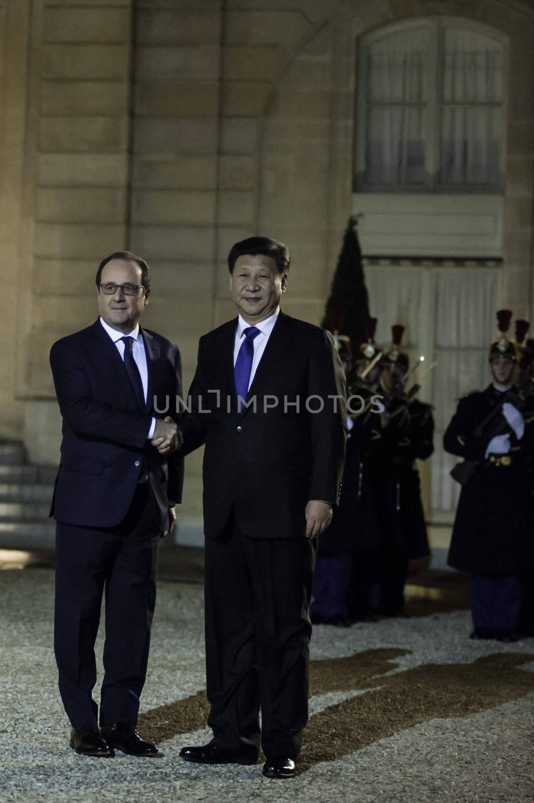FRANCE, Paris : China's President Xi Jinping (R) shakes hands with France's President Fran�ois Hollande (L) on November 29, 2015 before a dinner meeting at the Elysee palace in Paris. Some 150 leaders including will attend the start on November 30 of the UN conference on climate change, tasked with reaching the first truly universal climate pact.