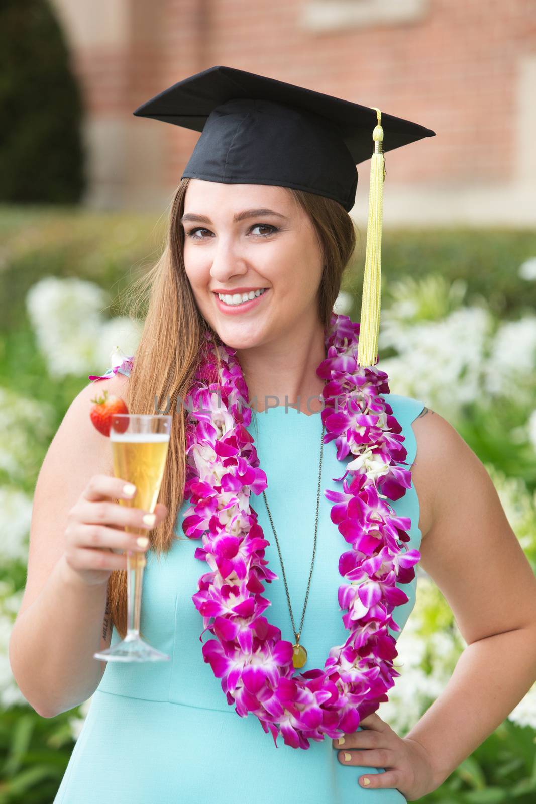 Smiling young female college student with boa and wine