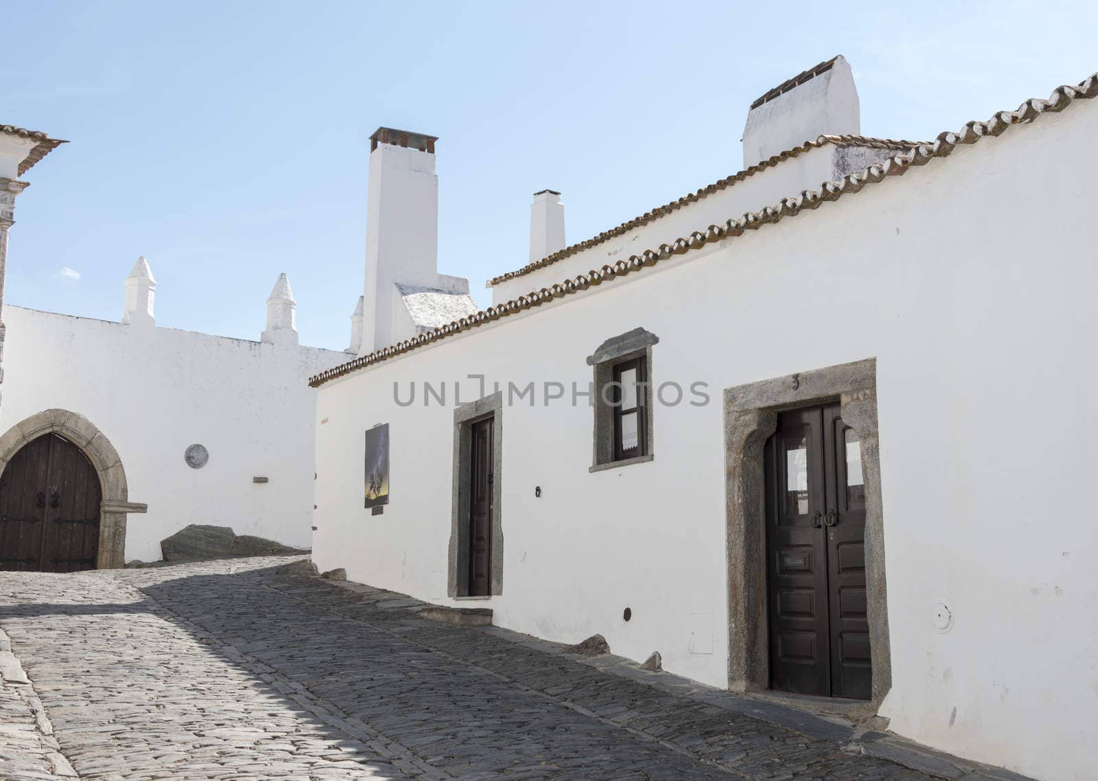 street with white houses monsaraz in alentejo portugal