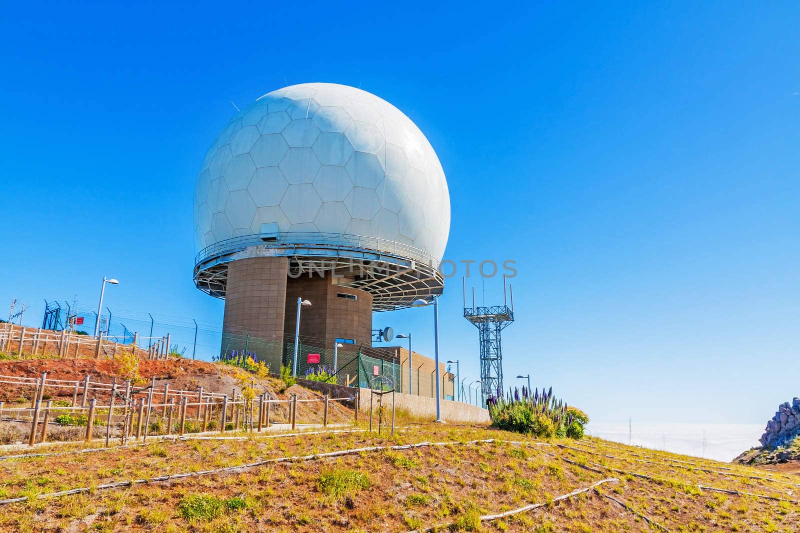 Madeira, Portugal - June 6, 2013: Pico do Arieiro, the 3rd highest mountain of Madeira, Portugal with impressive radar station globe.