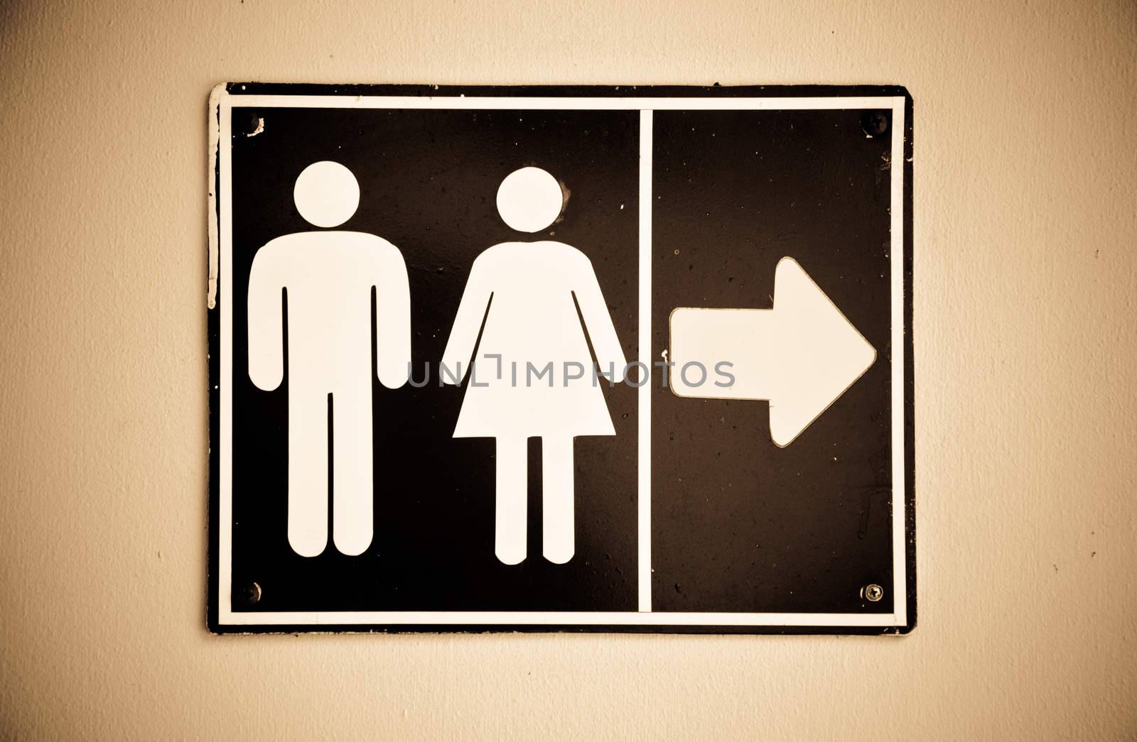 The public rest room old sign on wall.