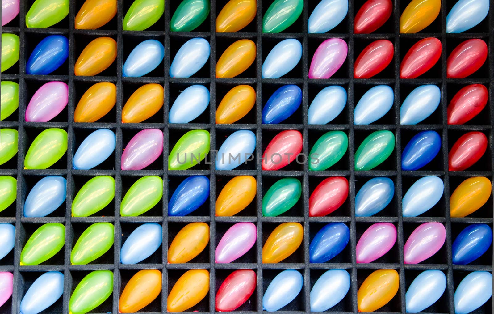 Many colorful balloons in block wood wall.