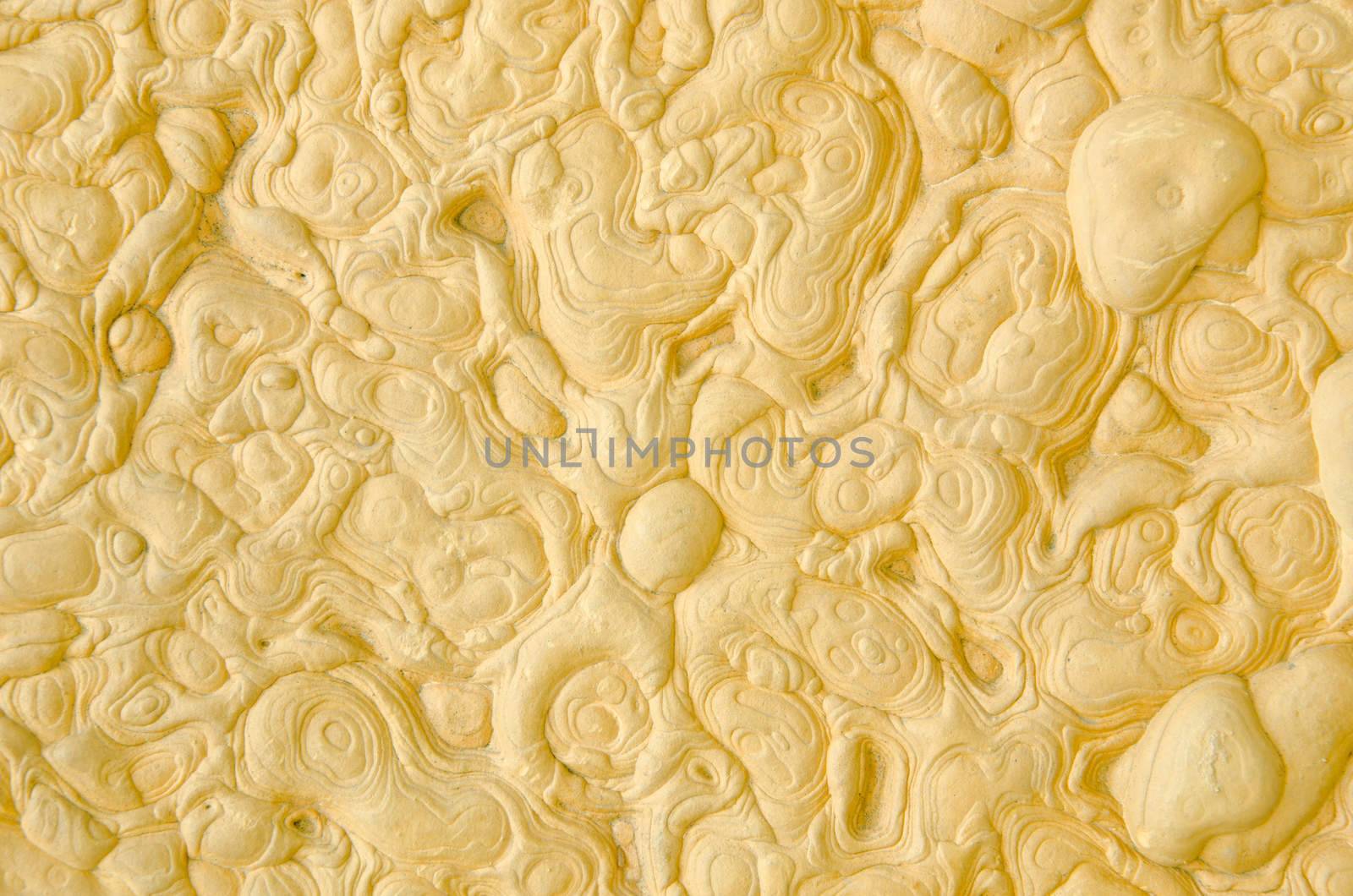 Surface of yellow stone background