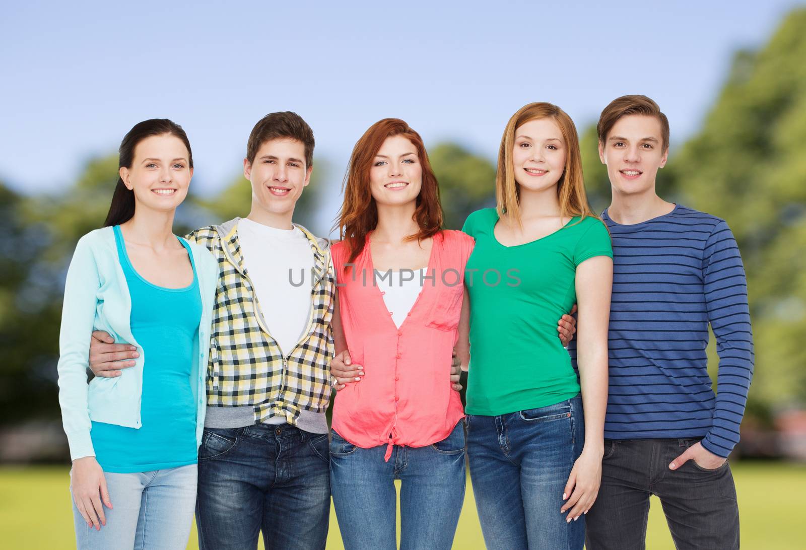 education and people concept - group of smiling students standing