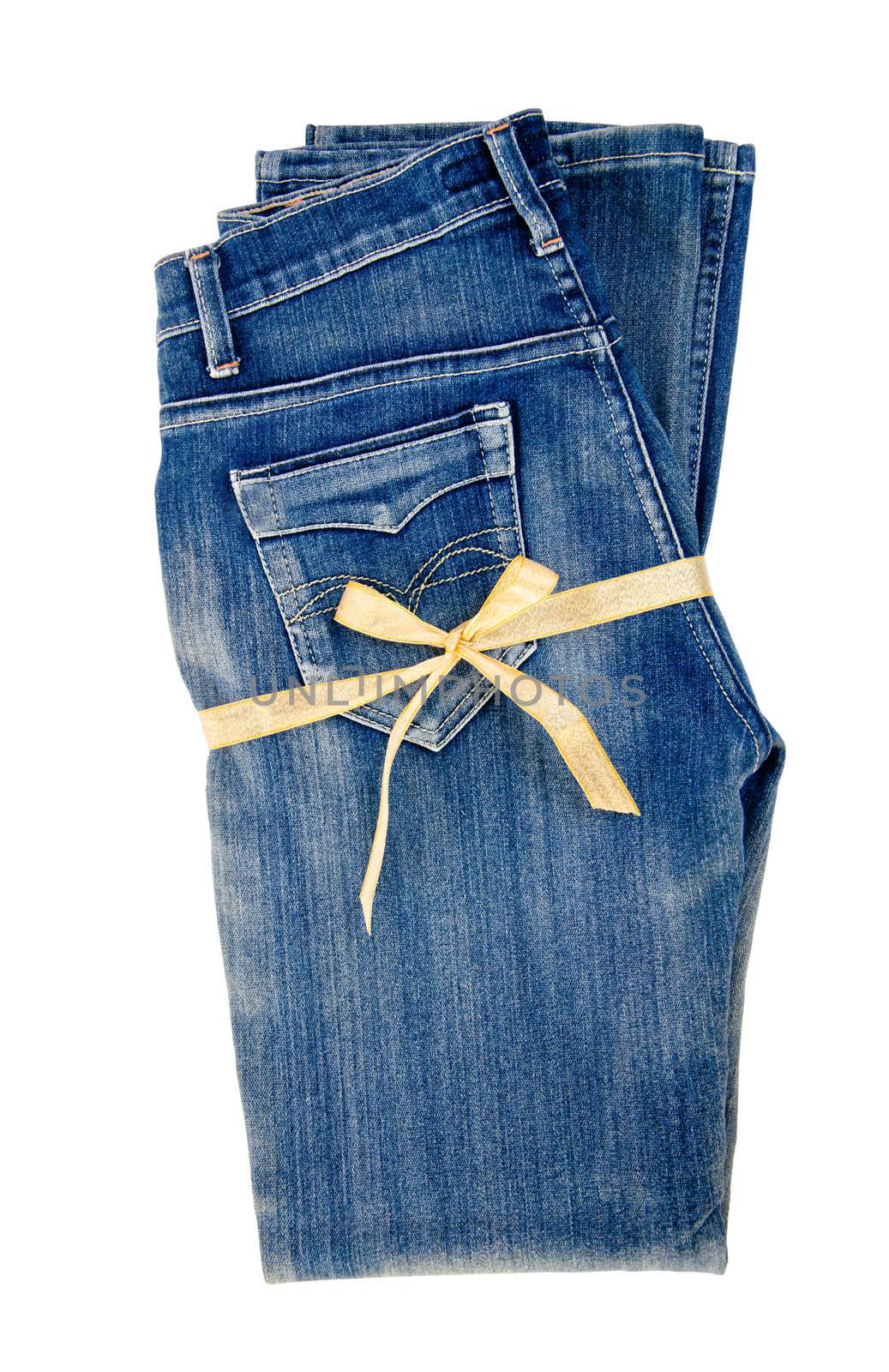blue jeans and gold ribbon isolated on white background. Gift concept.