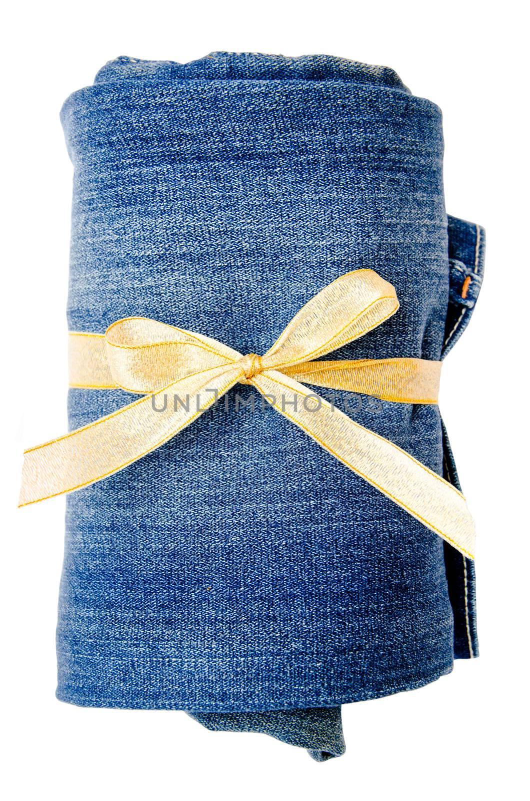 blue jeans and gold ribbon isolated on white background. Gift concept.