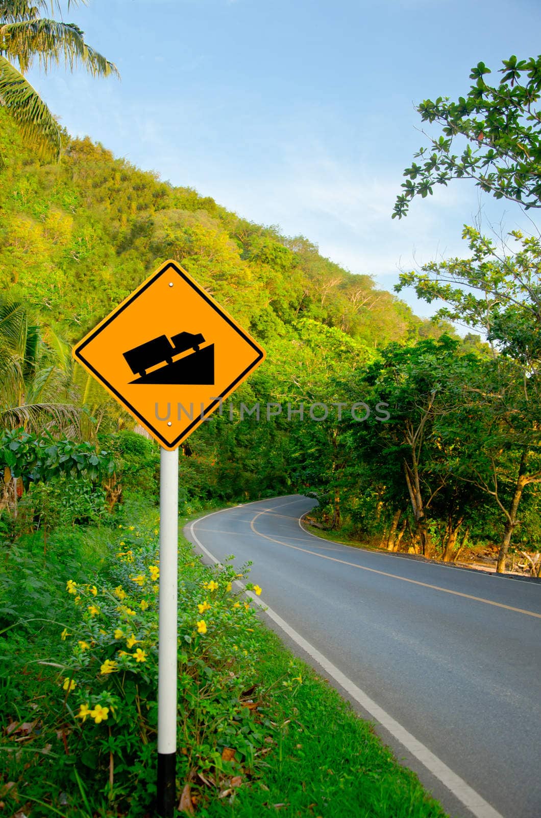 Steep grade hill traffic sign on road by Gamjai