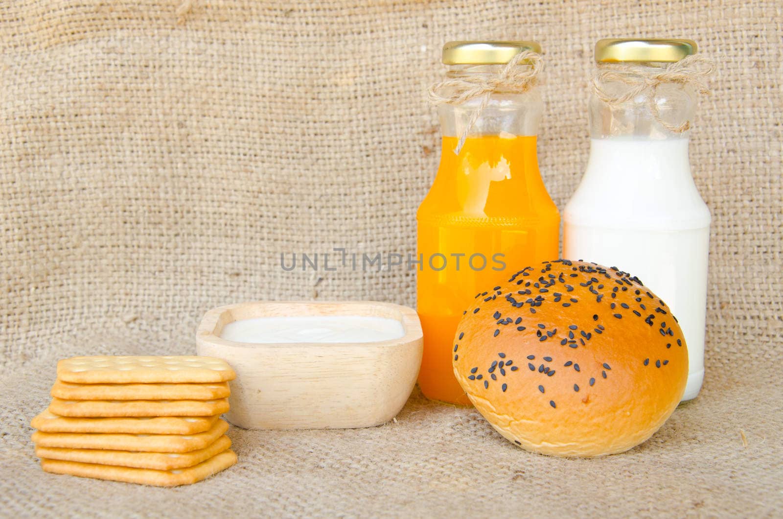 Whole wheat bread and biscuits in breakfast set on sack background