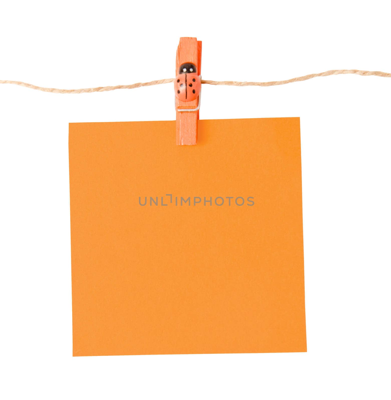 Pinned orange notepad isolated on white background, clipping path