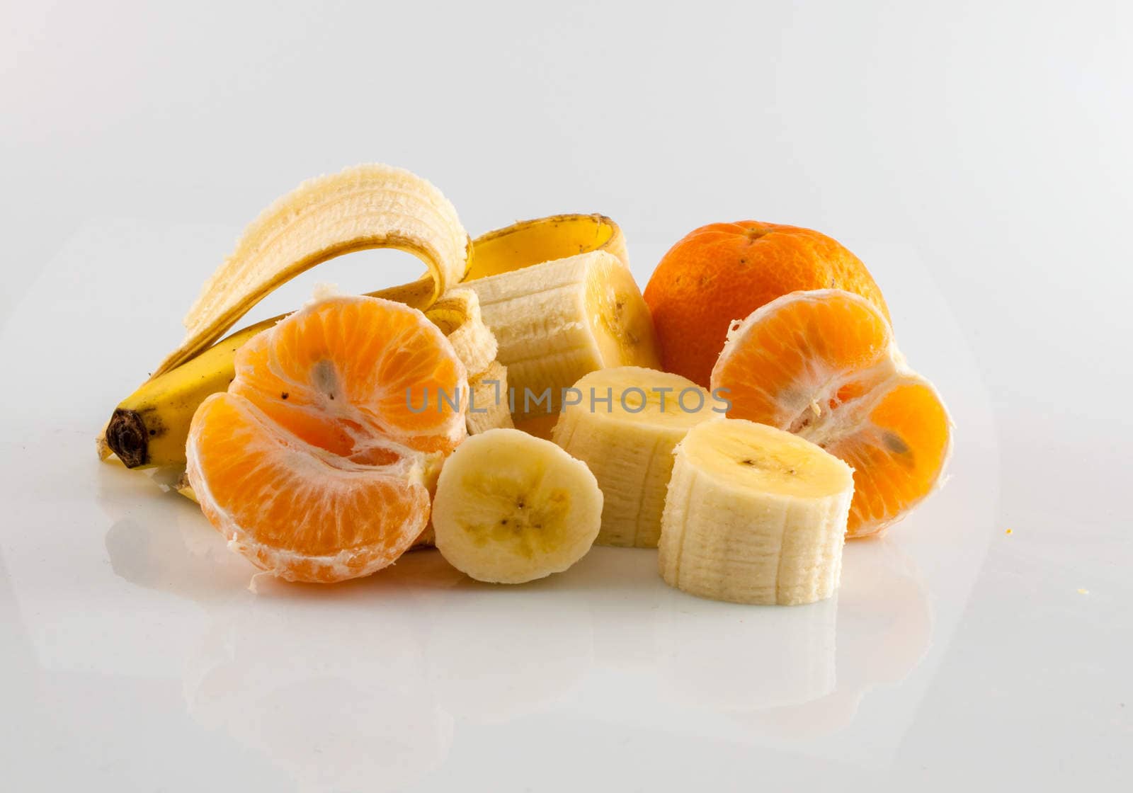 Banana and tangerine isolater on white background