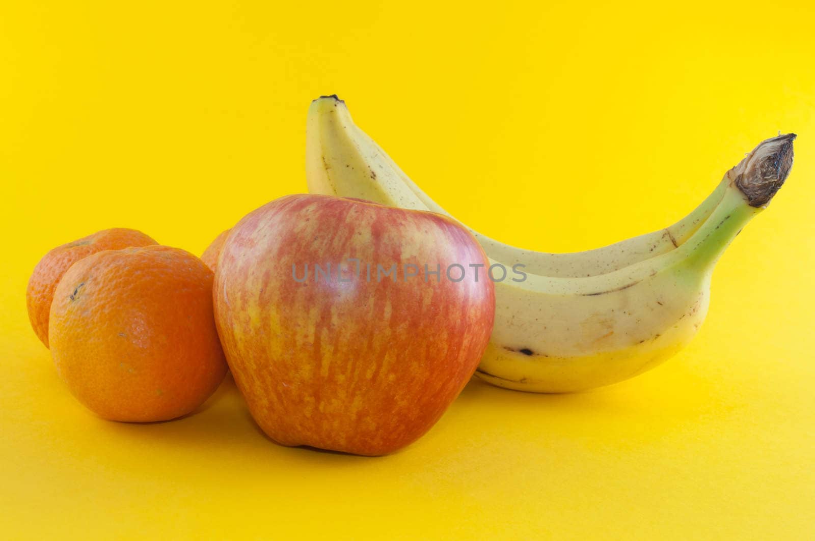 Banana, apple and tangerine isolated