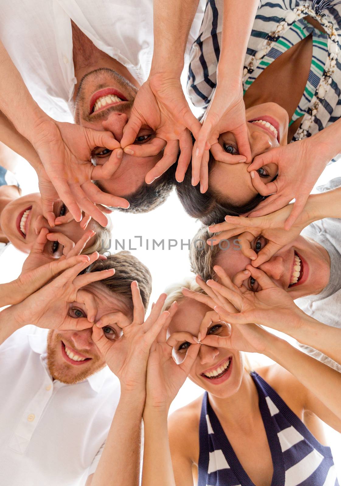 friendship, happiness and people concept - smiling friends in circle