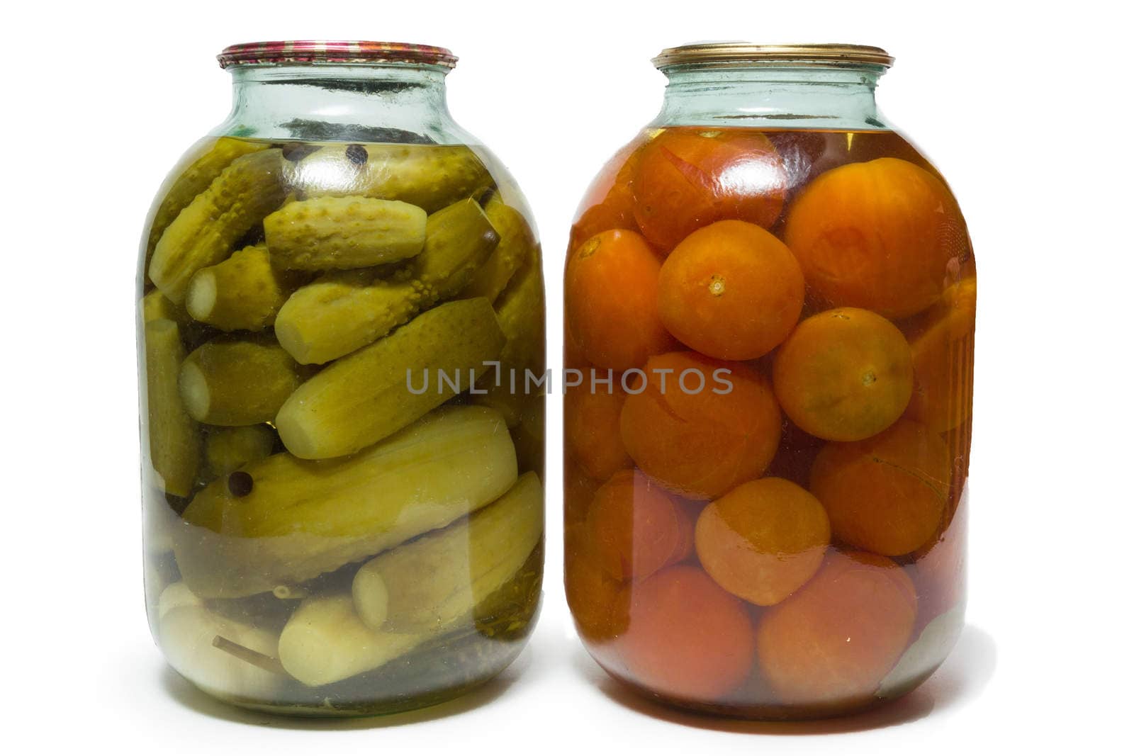 The photograph shows a bank with tomatoes and cucumbers on a white background