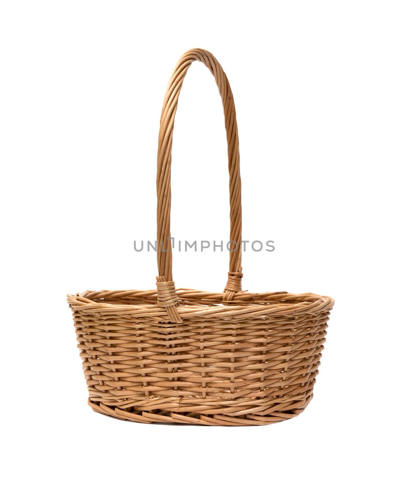 wicker basket isolated on white background by DNKSTUDIO