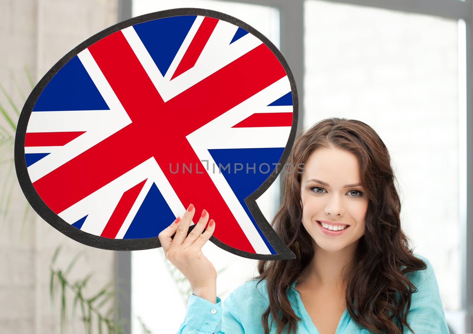education, foreign language, english, people and communication concept - smiling woman holding text bubble of british flag