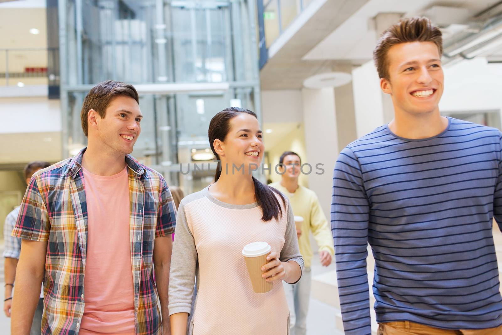 education, high school, friendship, drinks and people concept - group of smiling students with paper coffee cups