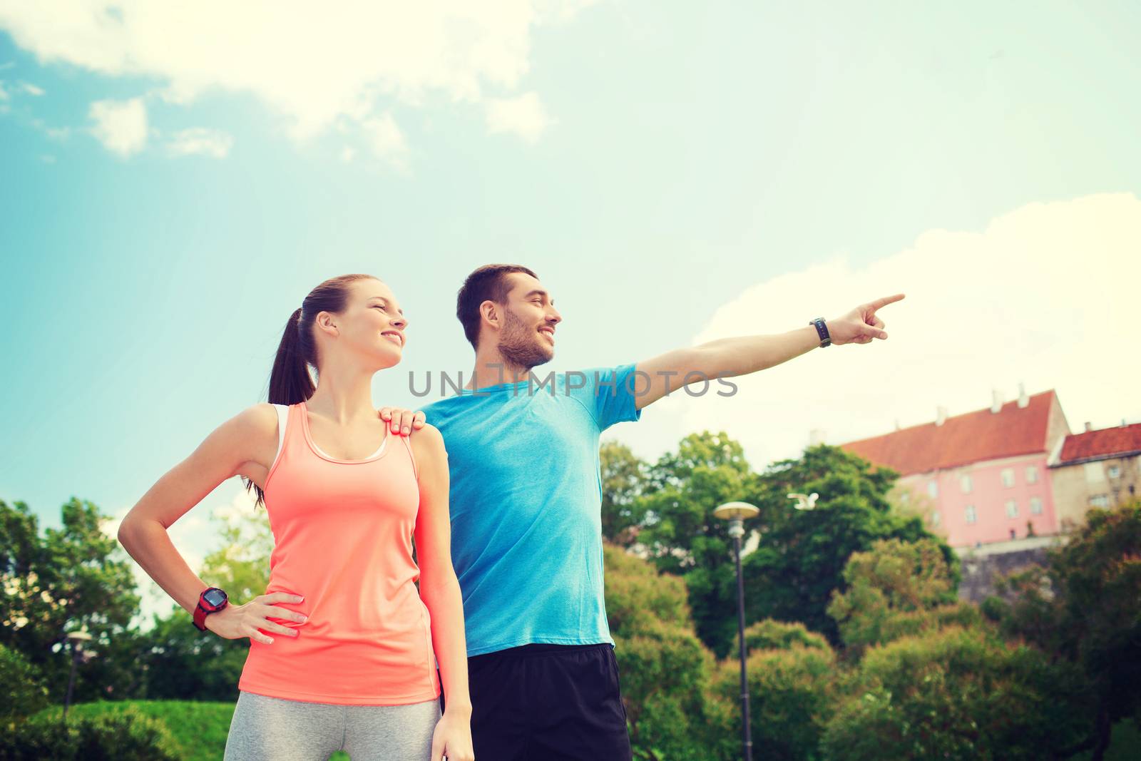 two smiling people outdoors by dolgachov