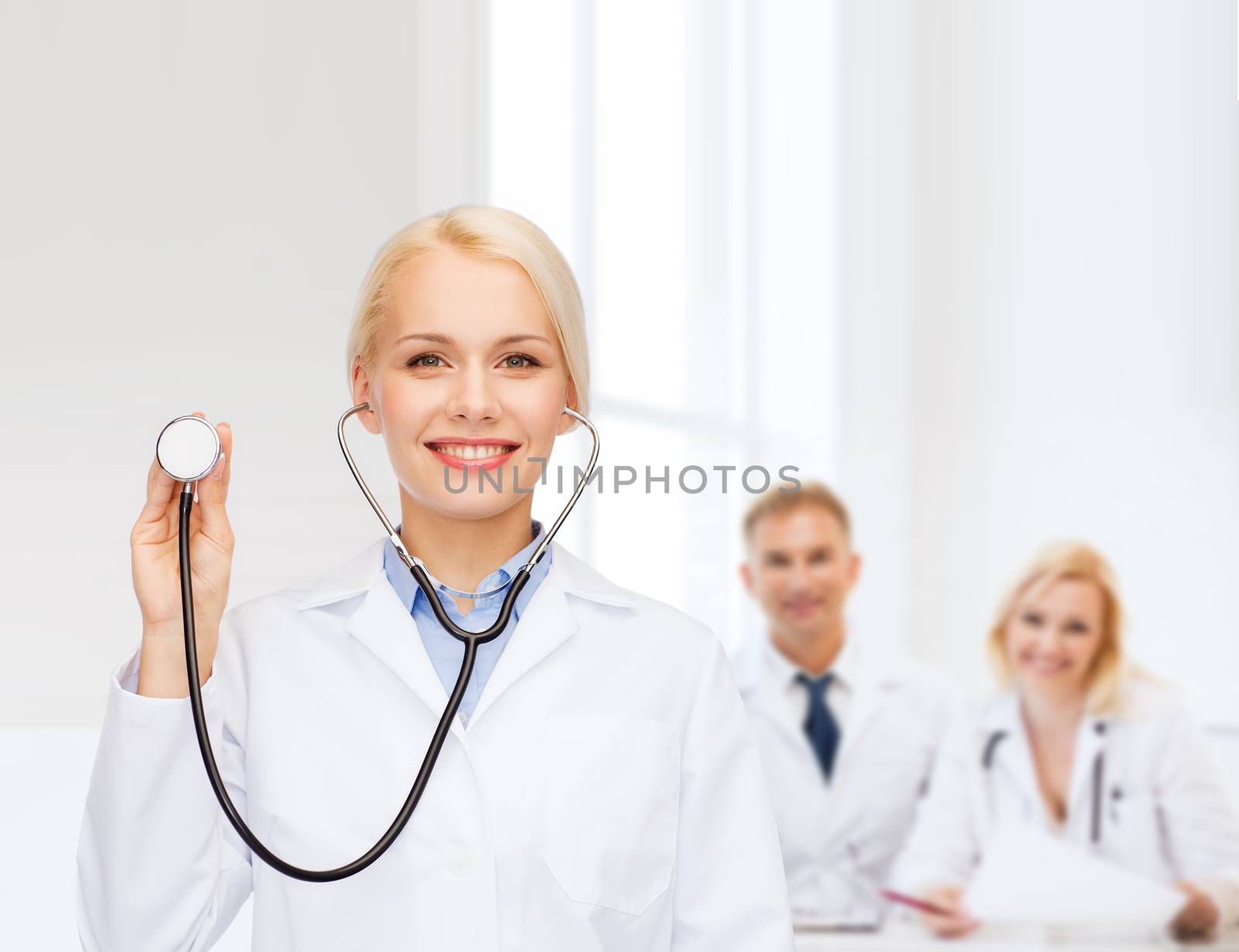 healthcare and medicine concept - smiling female doctor with stethoscope