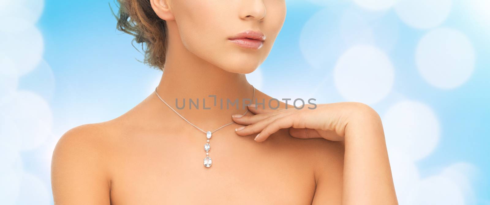 wedding, bridal, jewelry and luxury concept - beautiful woman wearing shiny diamond necklace
