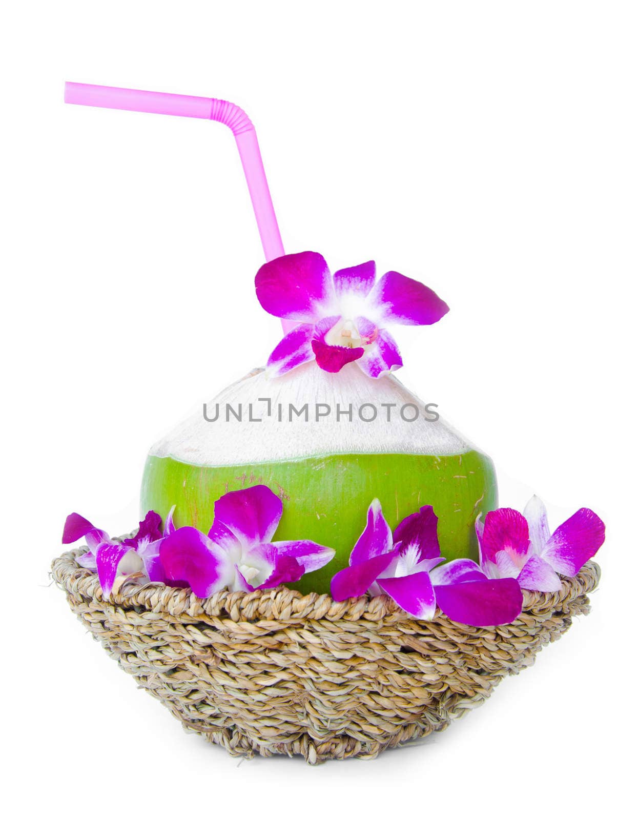 Green coconuts with drinking straw in weave basket isolated on white background.