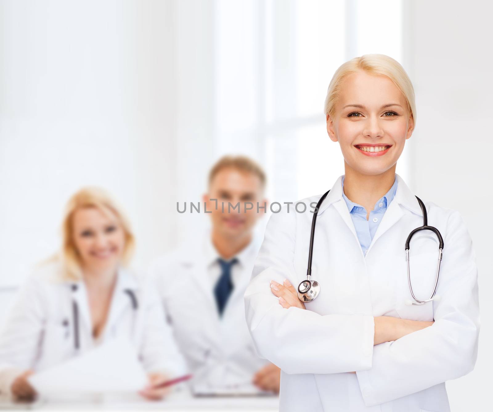 healthcare and medicine concept - smiling female doctor with stethoscope