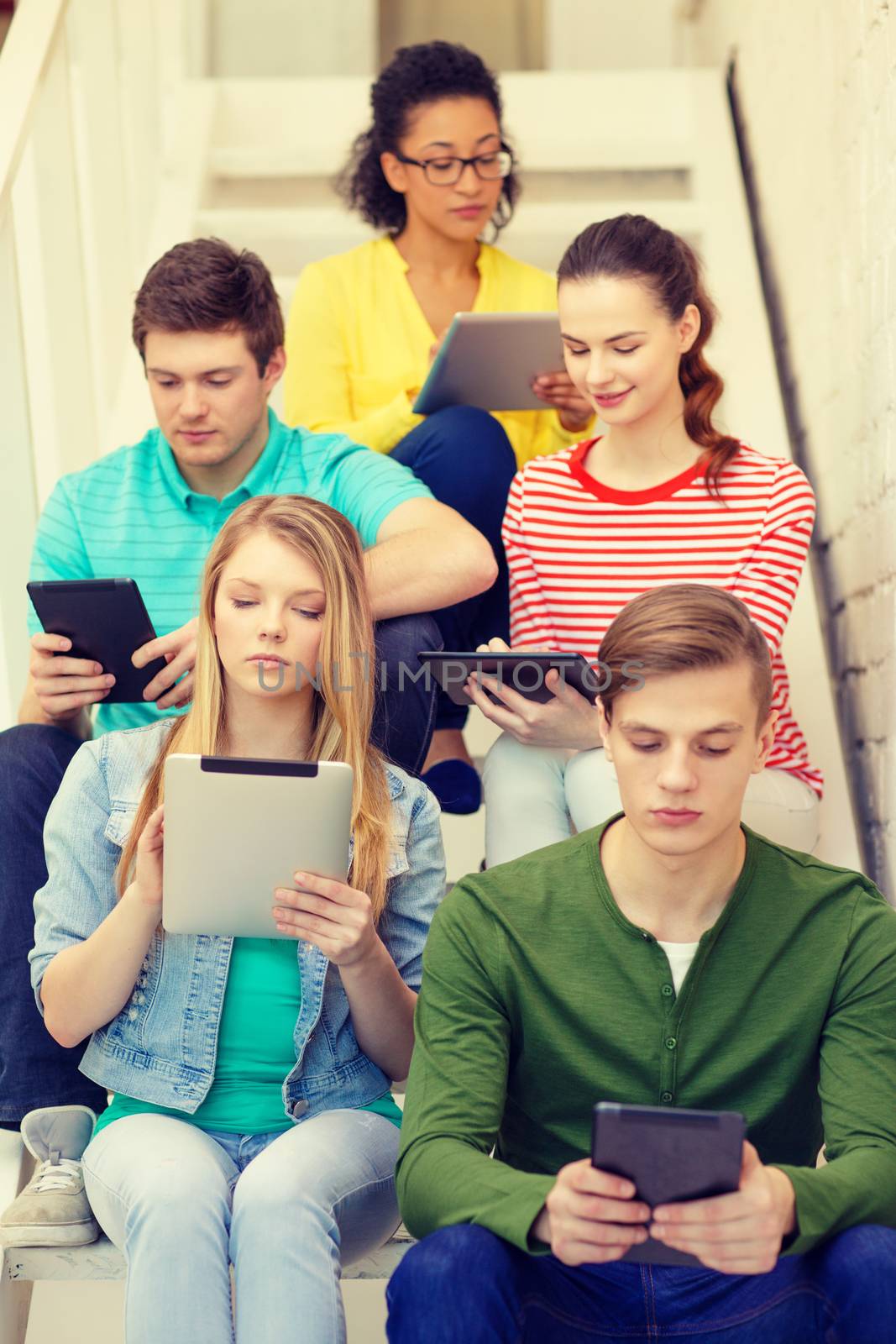 busy students with tablet pc computer by dolgachov
