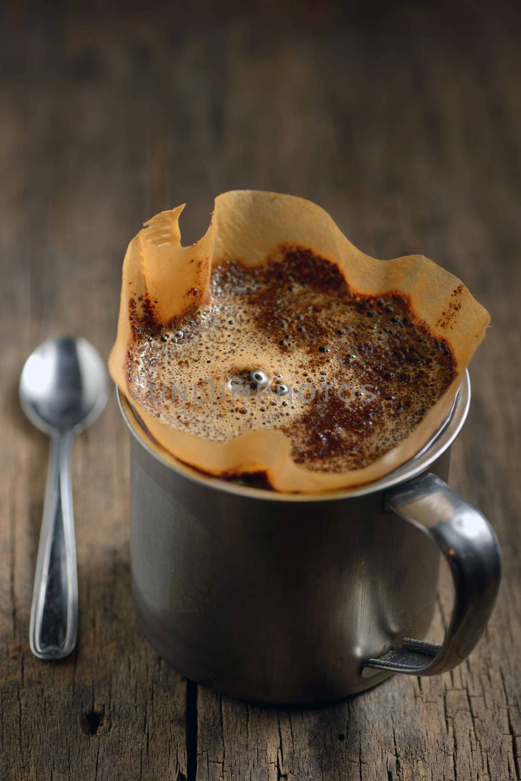 Ground coffee in cup and filter holder