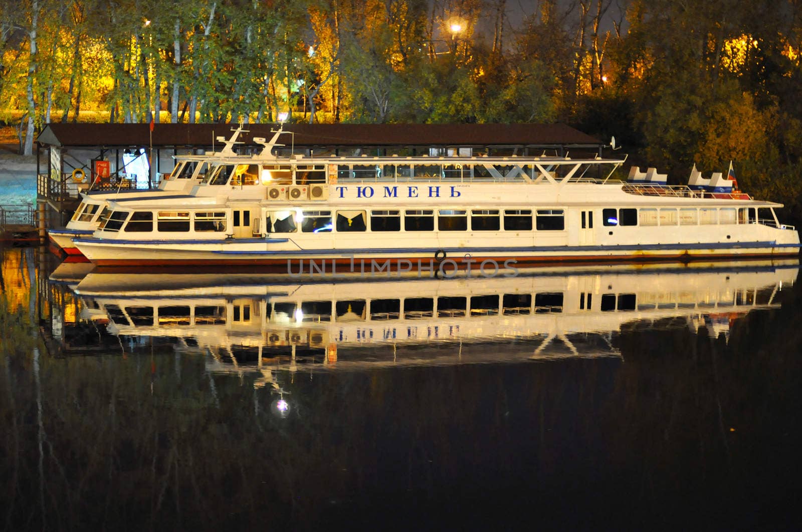 The boat "Tyumen" at the mooring on the Tura River in Tyumen at night, Russia.