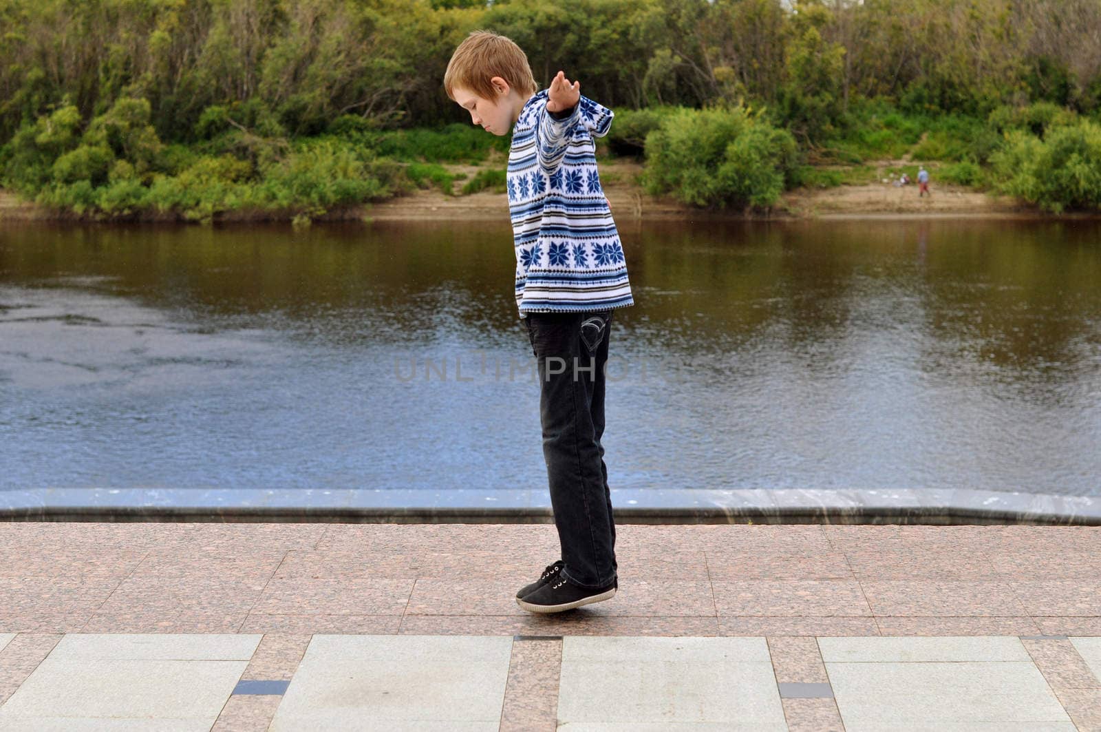 The teenage boy shows focus a levitation.