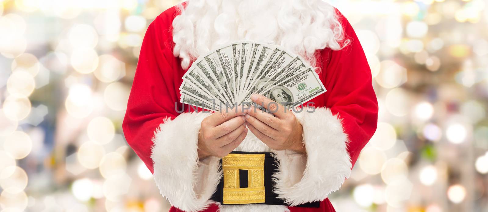 christmas, holidays, winning, currency and people concept - close up of santa claus with dollar money over lights background