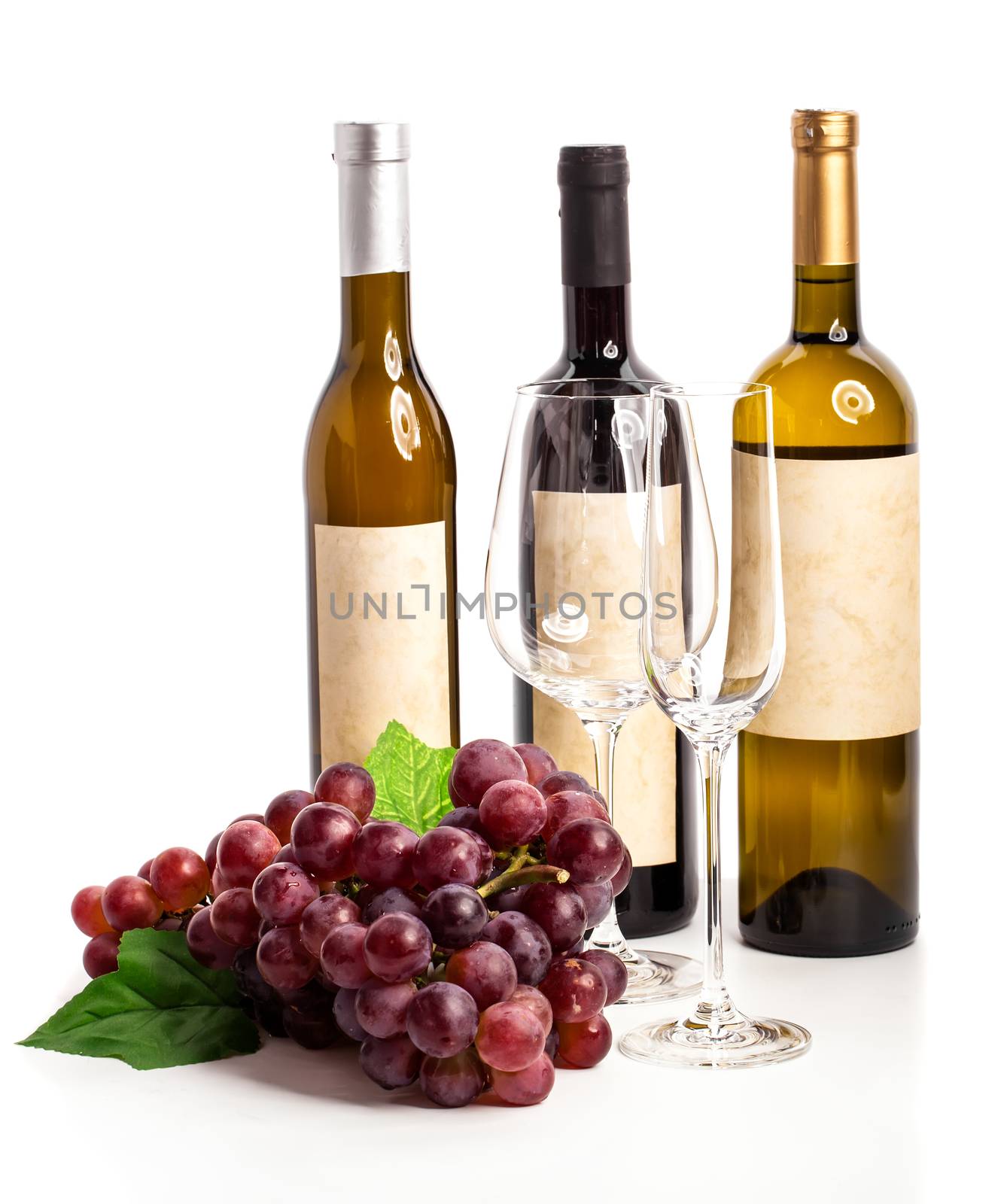 Bottle of red and white wine with grapes, white background by motorolka