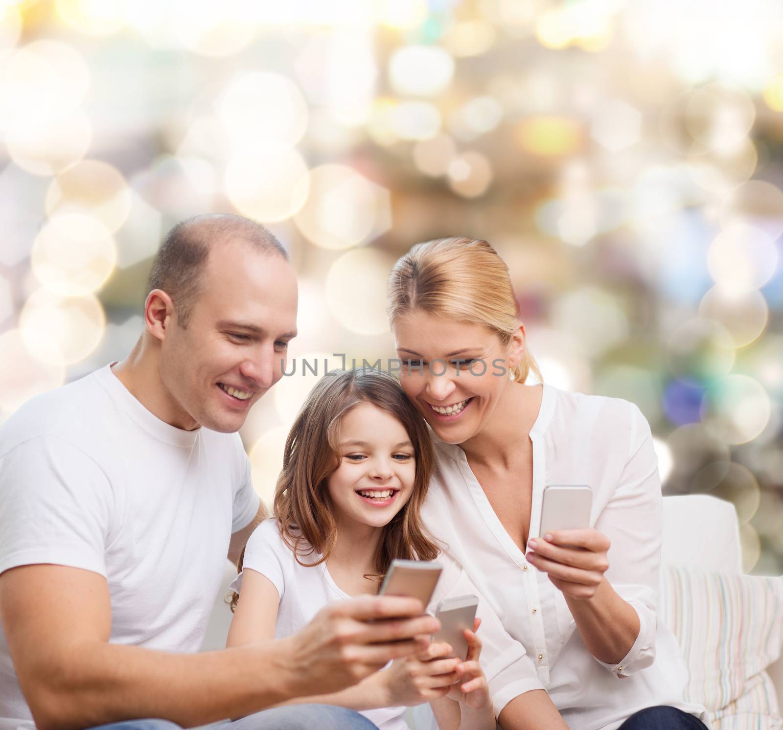 happy family with smartphones by dolgachov