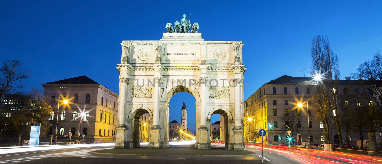 The Siegestor (english: Victory Arch) in Munich. This is a long exposure at dusk with traffic going around the arch