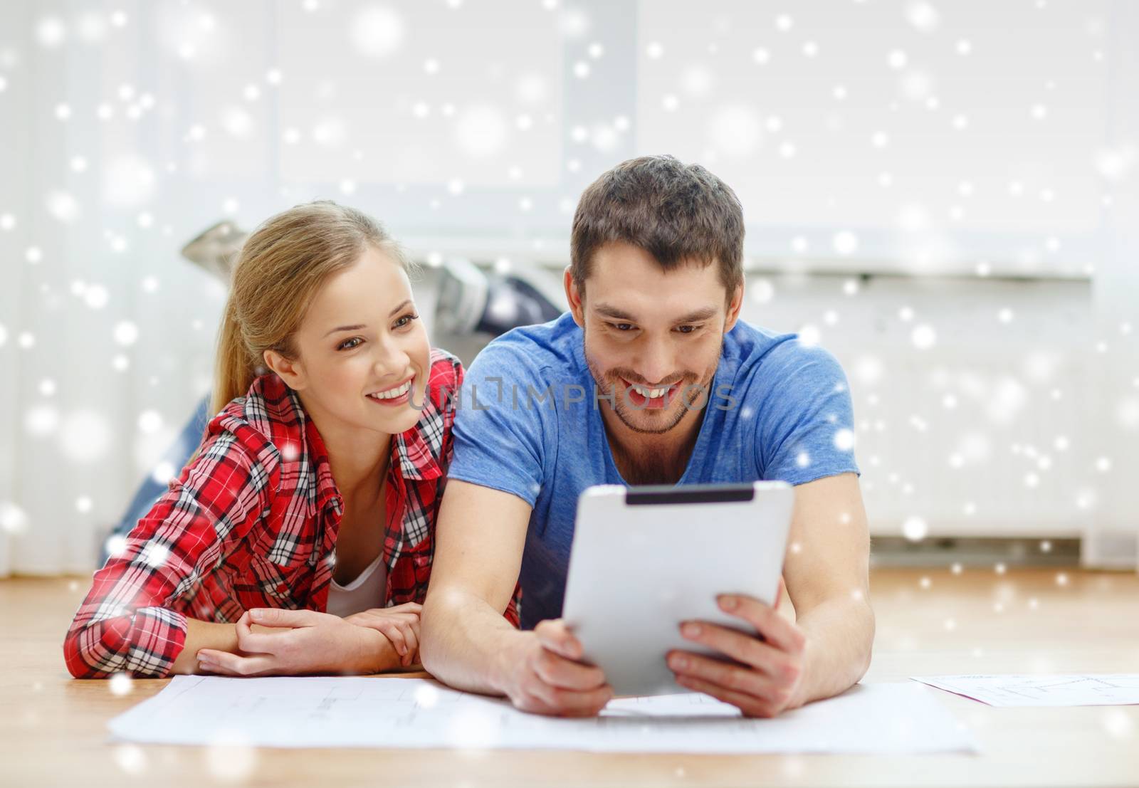 repair, building, renovation, technology and people concept - smiling couple with blueprint looking at tablet pc at home