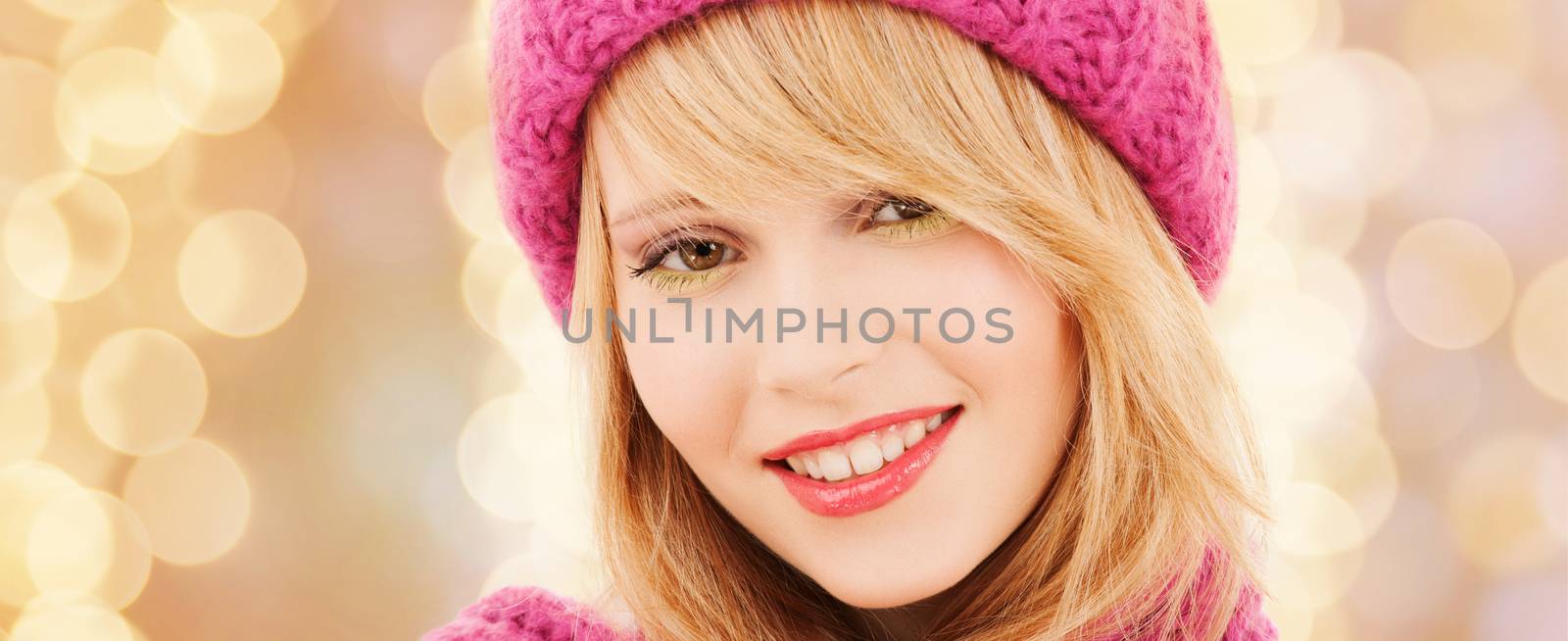 close up of smiling young woman in winter clothes by dolgachov