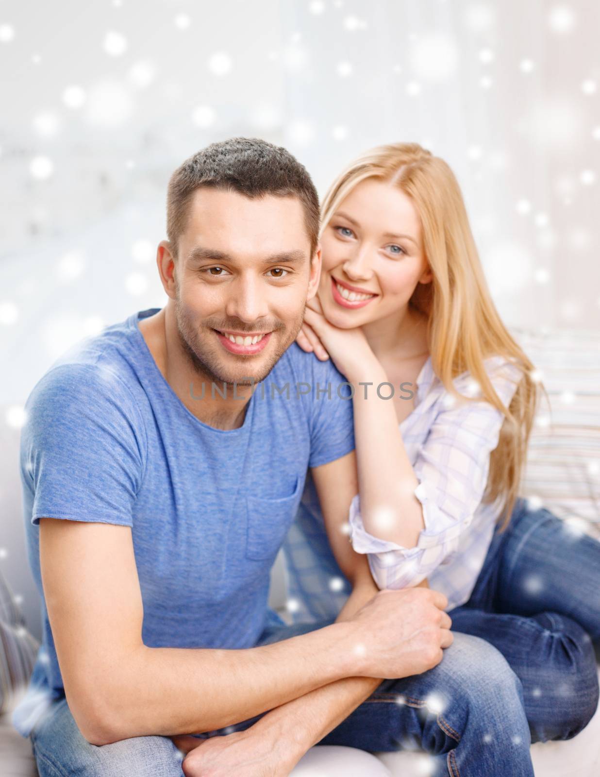 love, people and family concept - smiling couple hugging at home