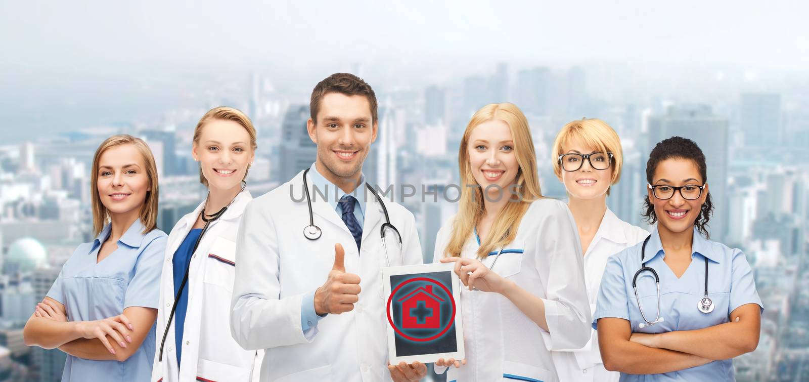 healthcare, medicine and technology concept - group of young doctors with tablet pc computer