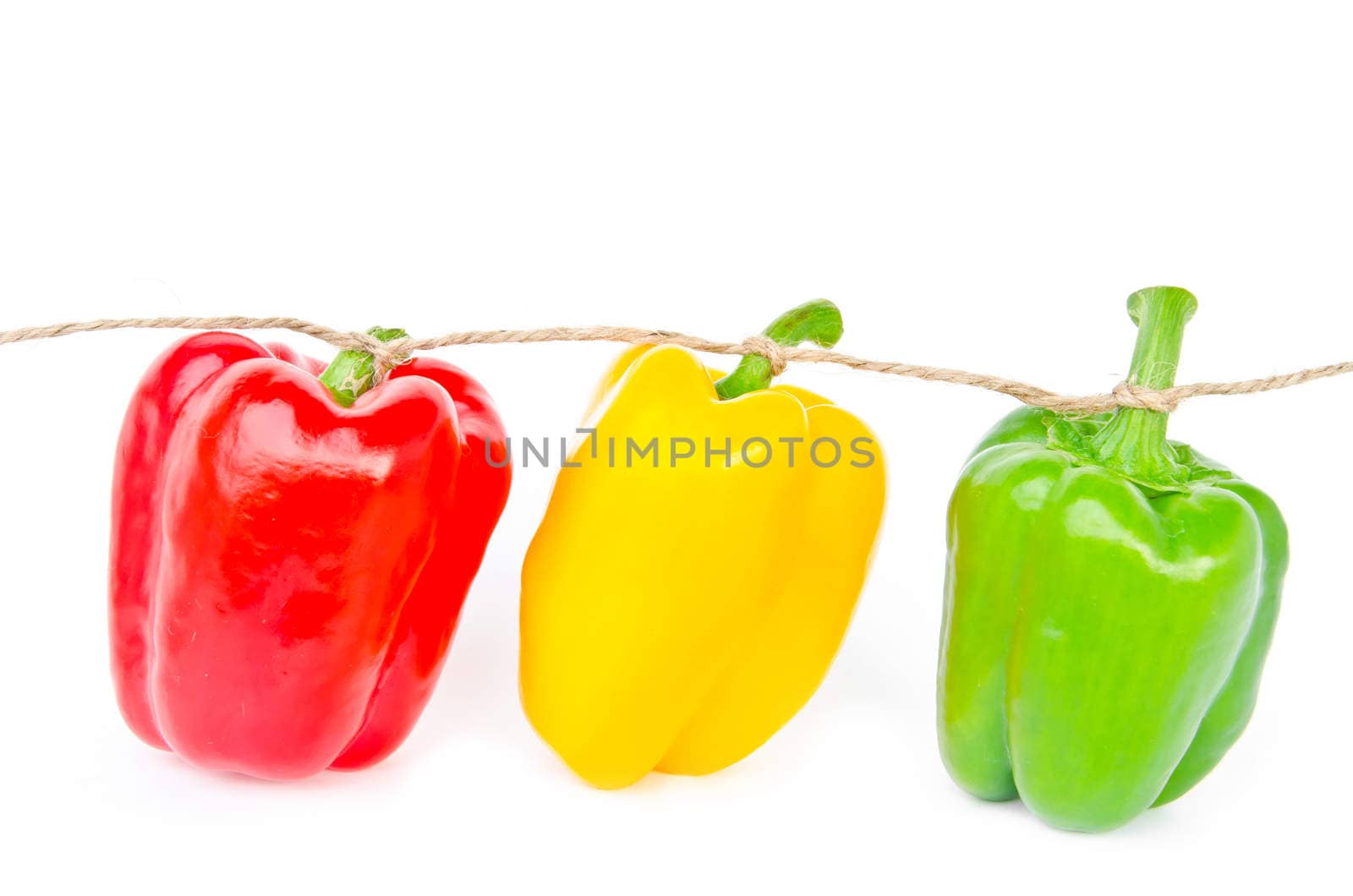 three bell peppers isolated on white background