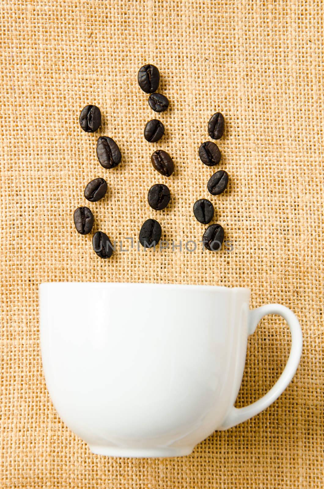 seed coffee and cup coffee on sack background