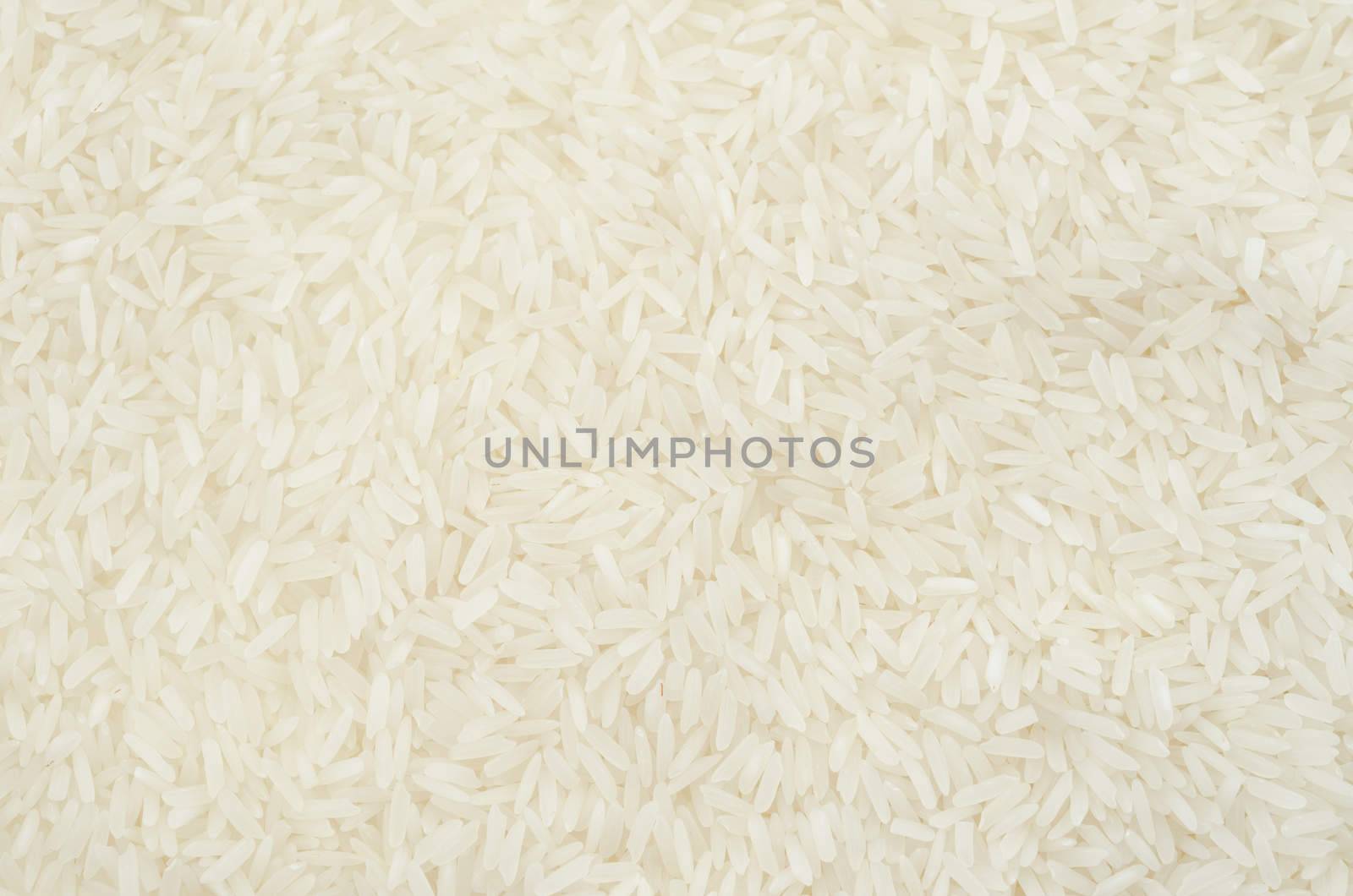 Raw white rice texture as background.