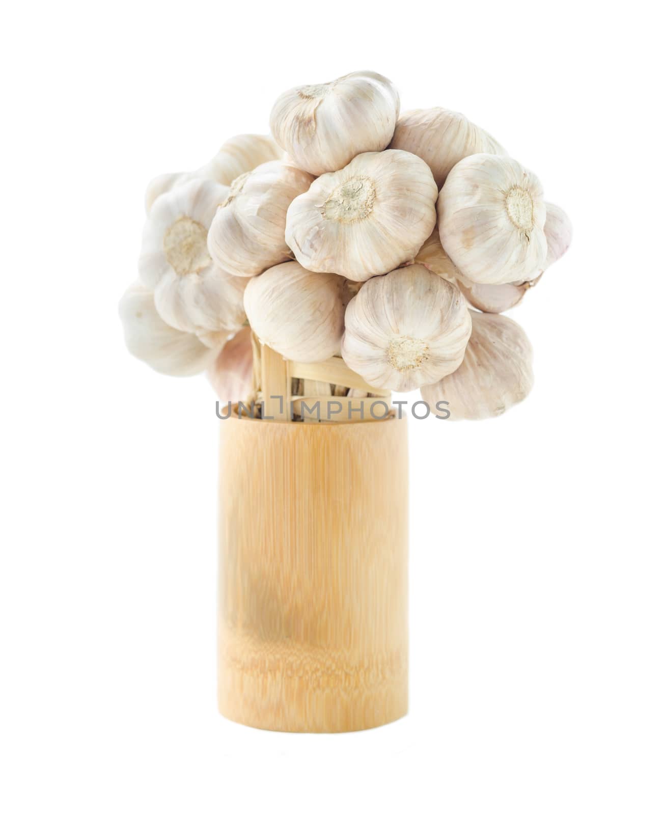 Fresh garlic in wooden cup on white background.
