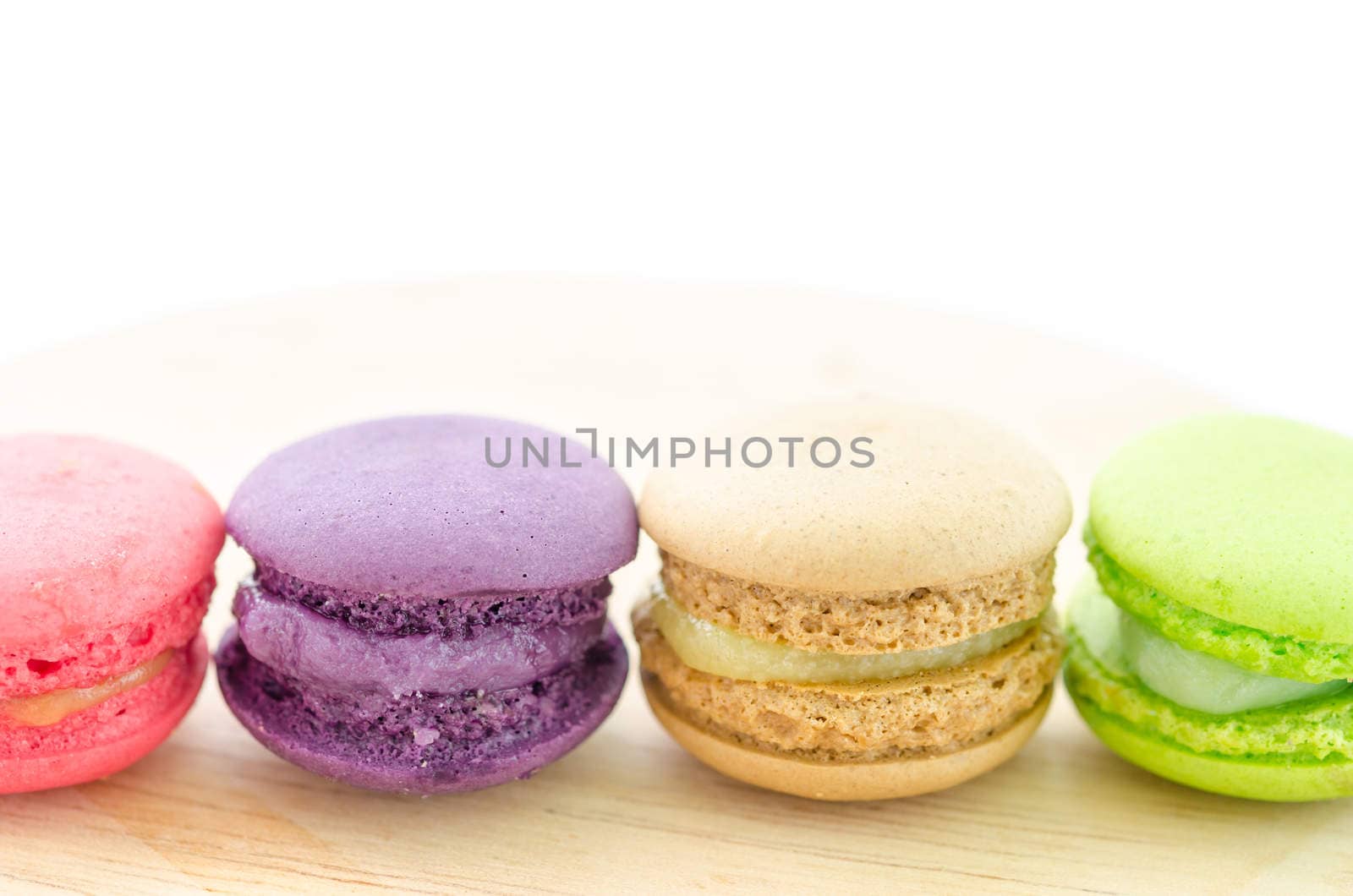 Colorful French Macaroon on wooden background