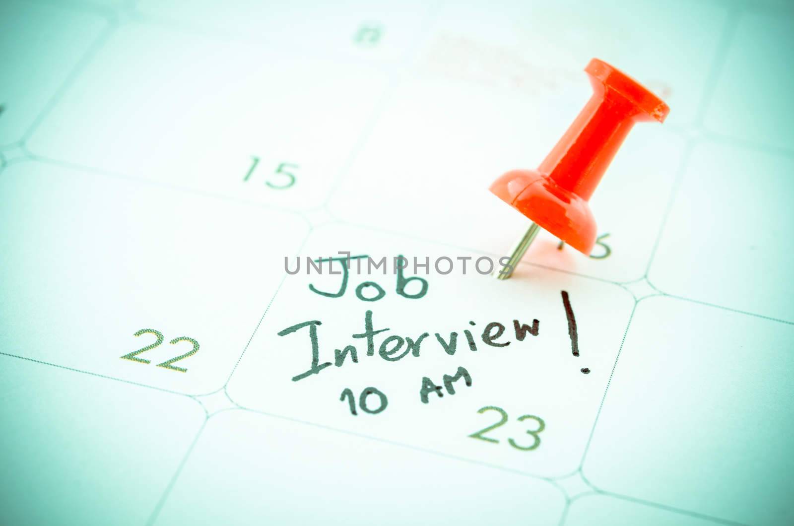 A Job Interview date written on a Calendar.
