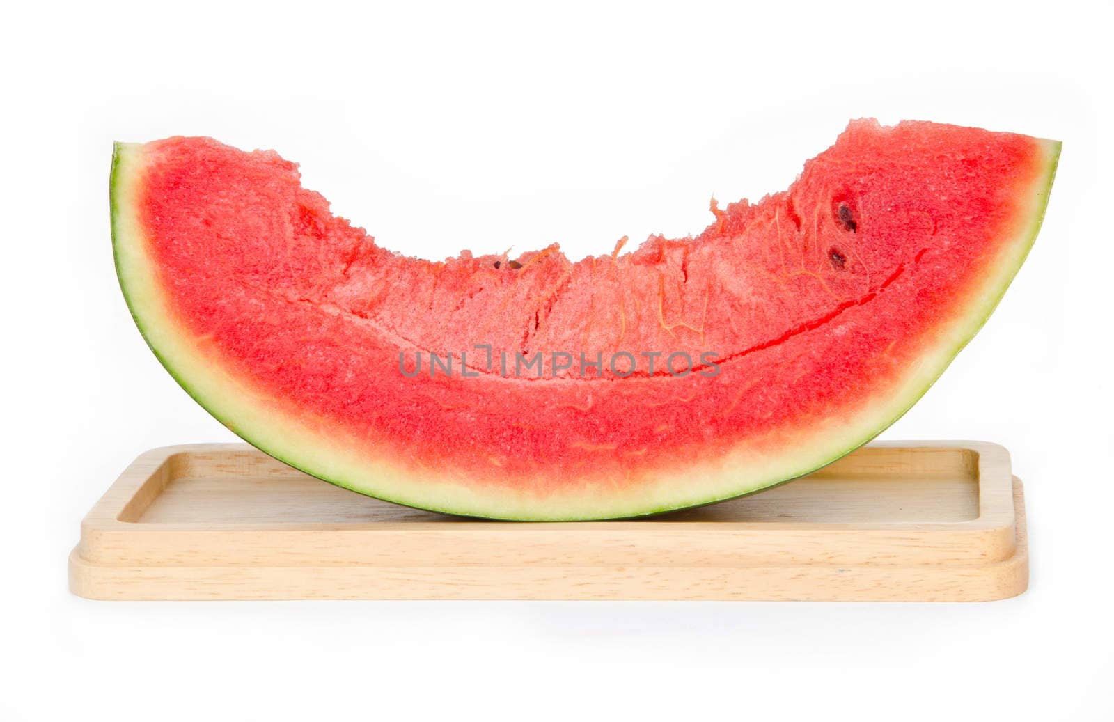 Watermelon slices on wooden plate, isolated on white background